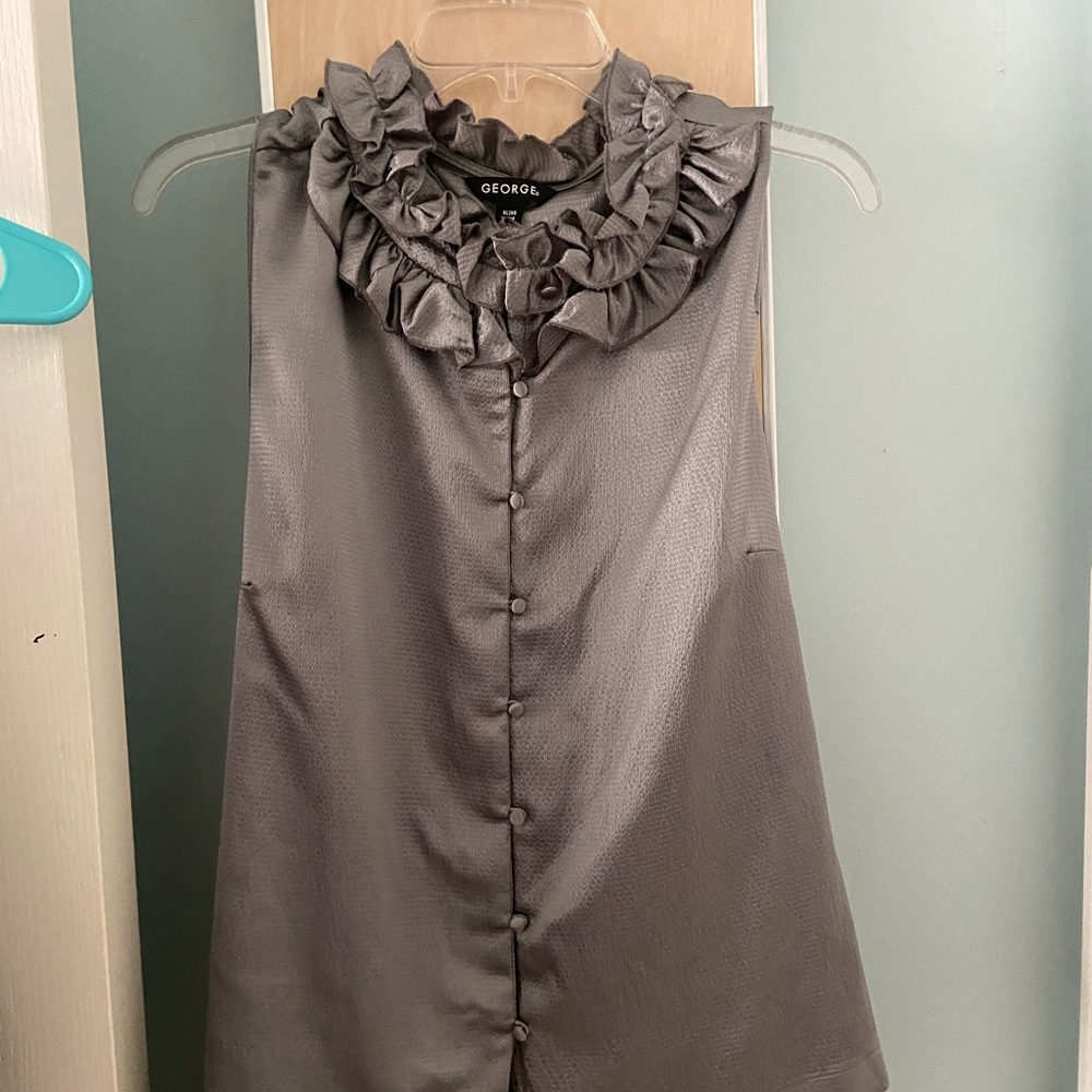 Silver sleeveless, ruffled business top.